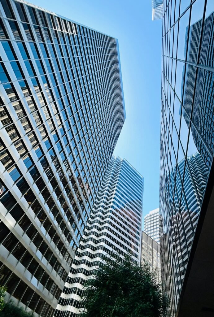 Low angle of high rise buildings with glass mirrored windows in downtown